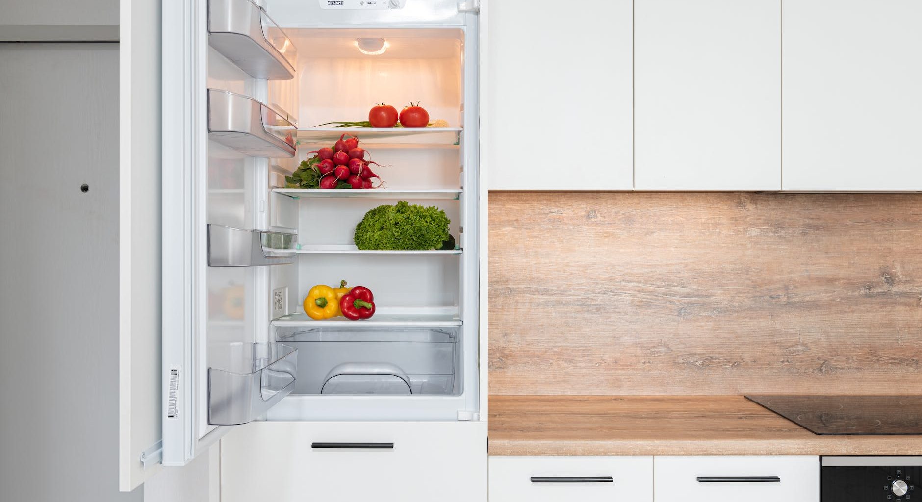 fridge with different vegetable in modern kitchen