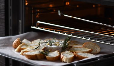 bread with meat on black tray