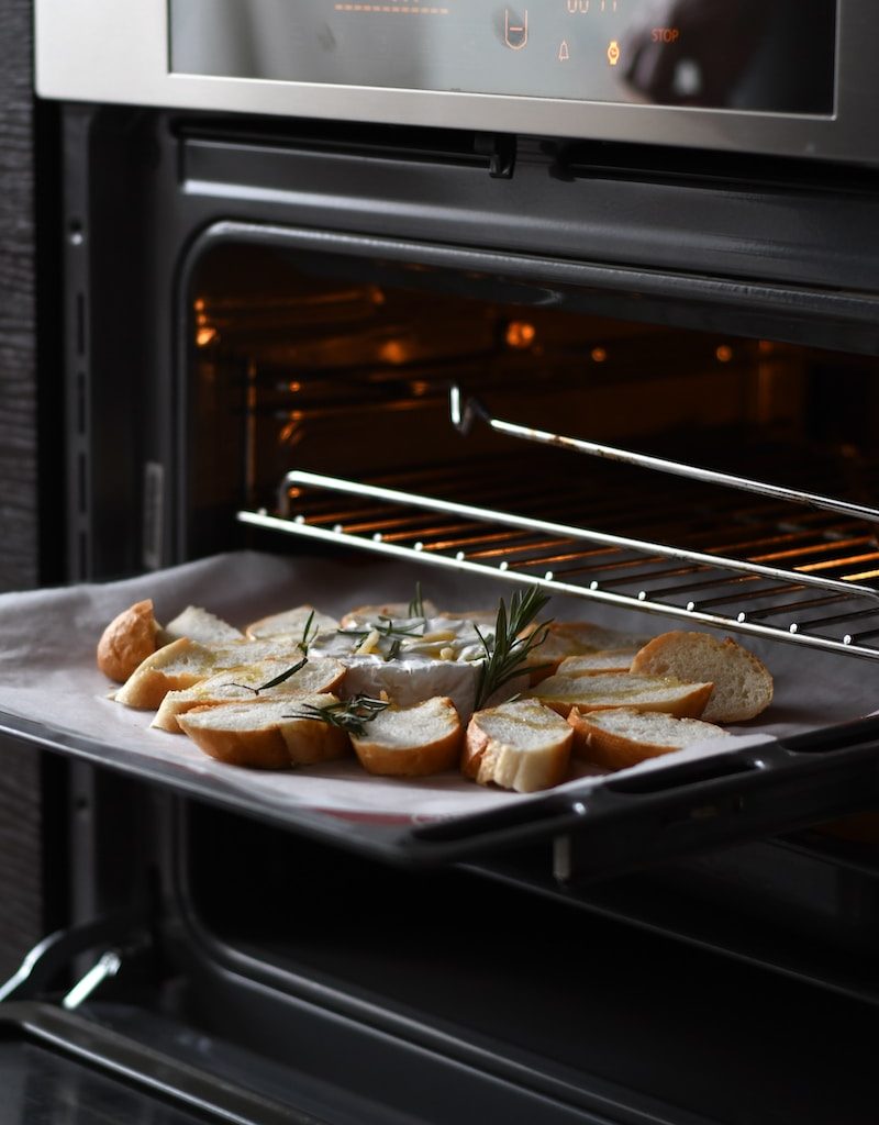 bread with meat on black tray