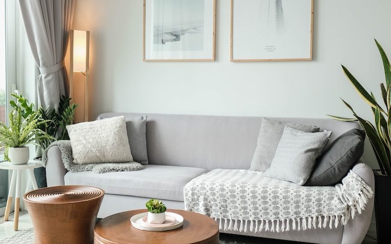 a living room filled with furniture and a large window