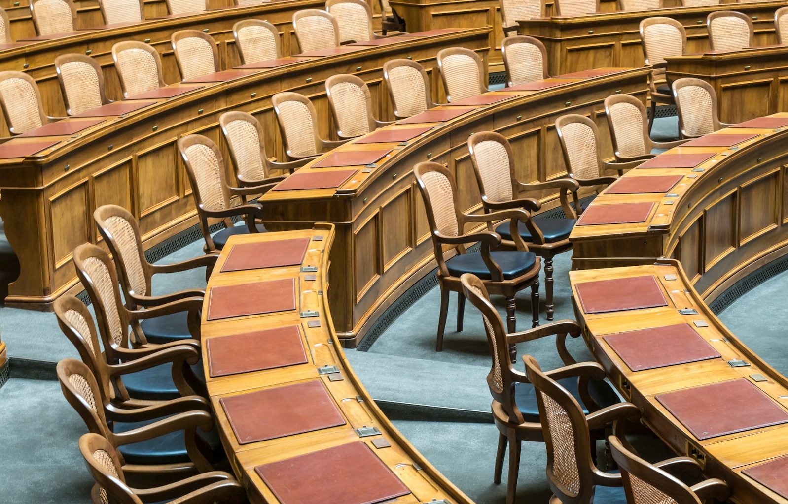 brown wooden chairs on blue and brown wooden floor