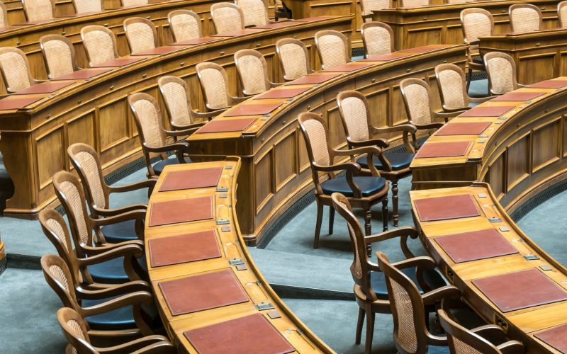 brown wooden chairs on blue and brown wooden floor