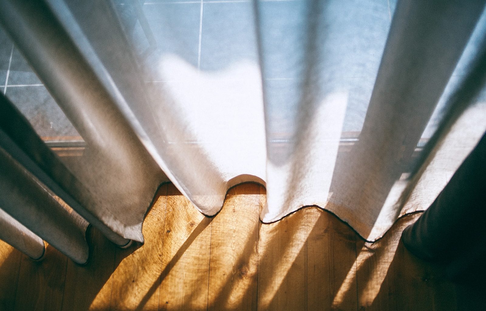 close up photo of white window curtain