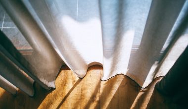 close up photo of white window curtain