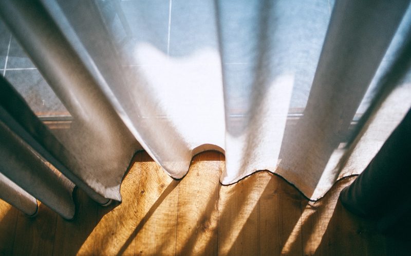 close up photo of white window curtain