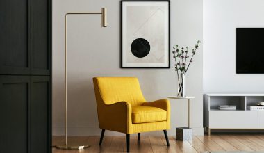 brown wooden framed yellow padded chair