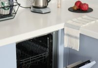 stainless steel kettle on white kitchen counter